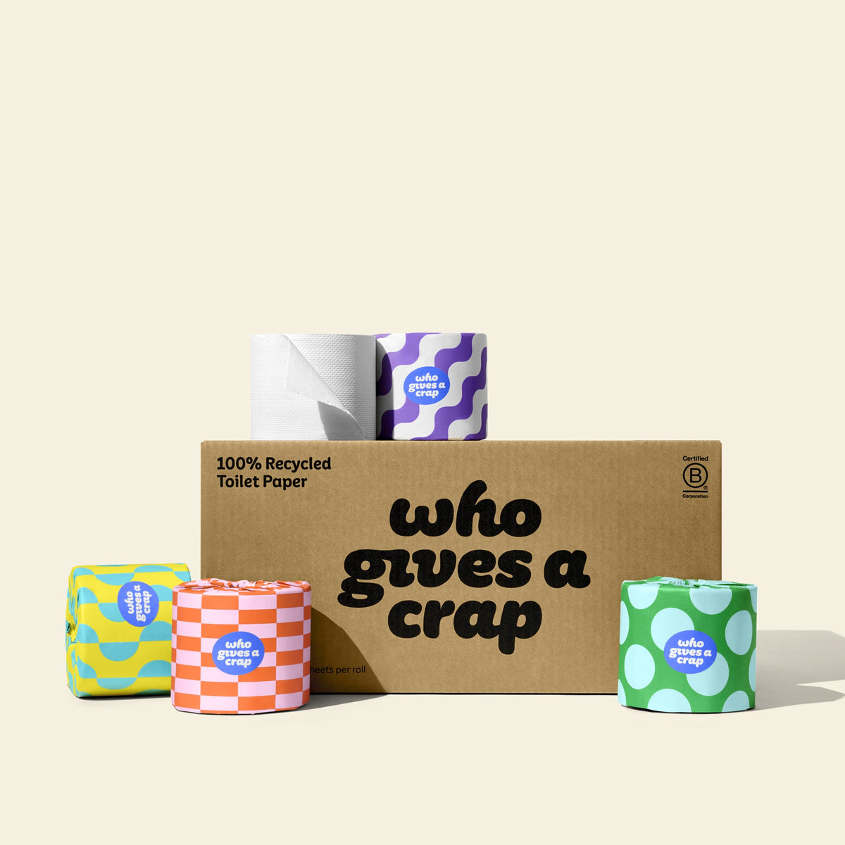 A medium box of Who Gives A Crap 100% Recycled Toilet Paper with colourful wrappers - eco-friendly, biodegradable and sustainable toilet paper