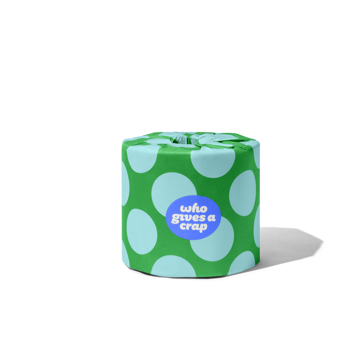 Singular toilet paper roll in a polka dot wrapper