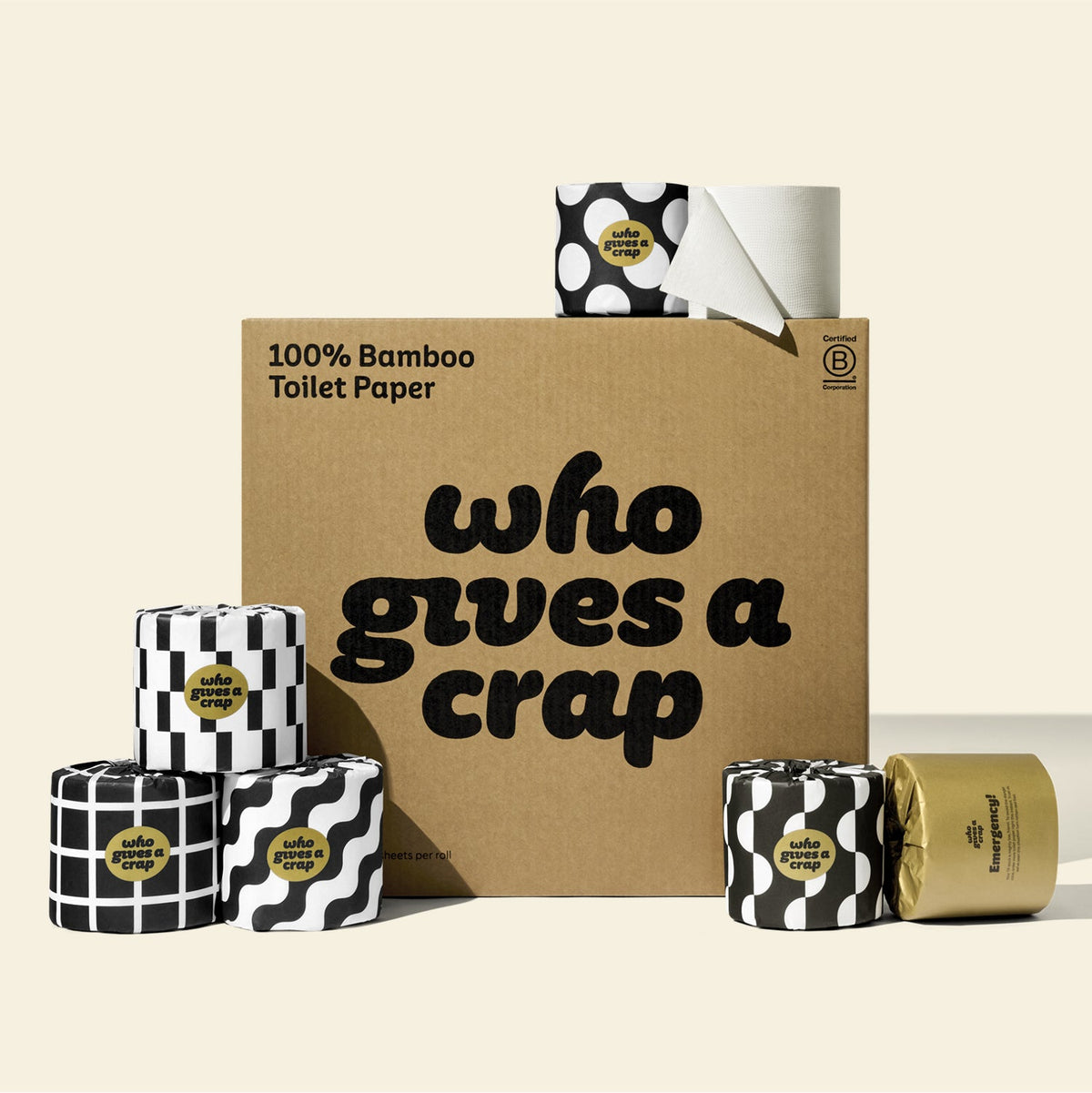 A large box of Who Gives A Crap 100% Bamboo Toilet Paper with black and white wrappers - eco-friendly, biodegradable and sustainable toilet paper