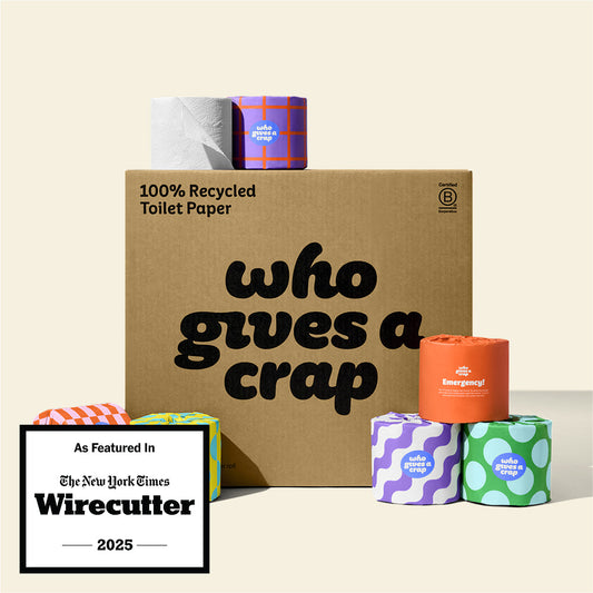 A large box of Who Gives A Crap 100% Recycled Toilet Paper with colorful wrappers - eco-friendly, biodegradable and sustainable toilet paper. Displays a badge stating "As Featured In The New York Times Wirecutter 2025"