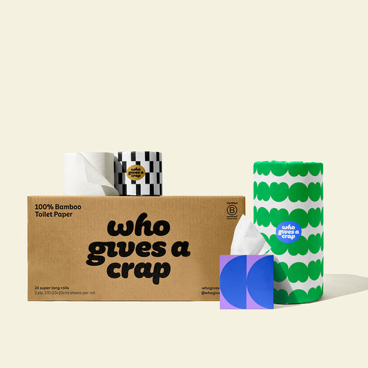 Bundle of Who Gives a Crap products with bamboo toilet paper, paper towel and tissues around a shipper box.